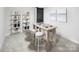 Basement with a dining table, stools and decorative shelves at 9416 Munsing Dr # 151, Charlotte, NC 28269