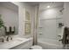 Well-lit bathroom featuring a tub and shower combo with brushed nickel fixtures at 9416 Munsing Dr # 151, Charlotte, NC 28269