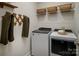 Modern laundry room featuring a Whirlpool washer and dryer with an efficient and practical design at 9416 Munsing Dr # 151, Charlotte, NC 28269