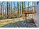 A home's wood deck and tree-lined backyard create a peaceful outdoor setting at 955 General Hoke Dr, Lincolnton, NC 28092