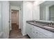 Bathroom featuring double sinks, granite countertops, and a linen closet at 955 General Hoke Dr, Lincolnton, NC 28092