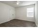 Neutral bedroom featuring wood floors, a ceiling fan, a window, and a double door closet at 955 General Hoke Dr, Lincolnton, NC 28092