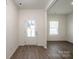Bright foyer with wood-look flooring and a front door with glass panels at 955 General Hoke Dr, Lincolnton, NC 28092