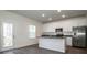 Modern kitchen with white cabinets, granite countertops, and stainless steel appliances at 955 General Hoke Dr, Lincolnton, NC 28092