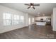 Open-concept living room flows into the kitchen with stainless steel appliances at 955 General Hoke Dr, Lincolnton, NC 28092