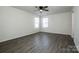 Spacious main bedroom with ample natural light and wood-look flooring at 955 General Hoke Dr, Lincolnton, NC 28092
