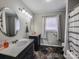 Bathroom with double sink vanity, large mirrors, and a patterned shower curtain at 1007 Little John Trl, Kannapolis, NC 28081