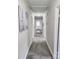 Hallway features neutral walls and carpet, multiple doors, and an open feel at 1007 Little John Trl, Kannapolis, NC 28081