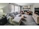 The inviting living room features neutral decor, fireplace, and a view to the backyard at 1007 Little John Trl, Kannapolis, NC 28081