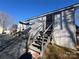 Exterior with gray siding, outdoor seating, stairs, and a glimpse of the neighborhood at 109 Hummingbird Cir, New London, NC 28127