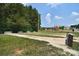 Horseshoe pits area with nearby playground, perfect for outdoor games and entertainment at 109 Hummingbird Cir, New London, NC 28127