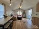 Inviting living space showcasing an open layout, sliding glass doors, comfortable seating and abundant natural light at 109 Hummingbird Cir, New London, NC 28127