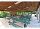 Covered picnic pavilion with many picnic tables and an indoor brick fireplace at 109 Hummingbird Cir, New London, NC 28127