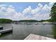 Picturesque waterfront featuring docks for boats, perfect for enjoying water activities and serene views at 109 Hummingbird Cir, New London, NC 28127