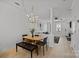 Elegant dining room with modern lighting and view to the living room at 11406 Potters Row, Cornelius, NC 28031