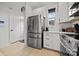 Kitchen featuring a stainless steel refrigerator, modern appliances, and white cabinetry at 11406 Potters Row, Cornelius, NC 28031