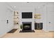 Living room with a fireplace, floating shelves, and a beverage cooler at 11406 Potters Row, Cornelius, NC 28031