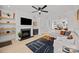 Stylish living room with fireplace, floating shelves, and modern decor at 11406 Potters Row, Cornelius, NC 28031