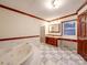 Bathroom featuring a jacuzzi tub, glass shower stall, and vanity with dark wood cabinets at 1200 Berkshire Dr, Kannapolis, NC 28081