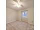 Bedroom featuring carpet, light walls, ceiling fan and a single window at 1200 Berkshire Dr, Kannapolis, NC 28081