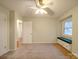 Bedroom with neutral carpet, a window bench, and a view into the hallway at 1200 Berkshire Dr, Kannapolis, NC 28081