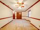 Spacious bedroom with neutral carpet, double doors and classic ceiling fan at 1200 Berkshire Dr, Kannapolis, NC 28081