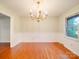 Dining room with traditional chandelier and wainscoting, bright natural light at 1200 Berkshire Dr, Kannapolis, NC 28081