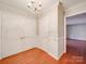 Elegant foyer featuring hardwood floors, chandelier, and closet for storage at 1200 Berkshire Dr, Kannapolis, NC 28081
