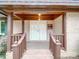 Inviting covered front porch with brick columns and a double door entrance at 1200 Berkshire Dr, Kannapolis, NC 28081