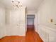 Hallway with hardwood floors and access to multiple rooms in the home at 1200 Berkshire Dr, Kannapolis, NC 28081