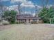 Traditional single-Gathering home with a brick facade and lush front yard at 1200 Berkshire Dr, Kannapolis, NC 28081
