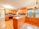 Charming kitchen featuring wood cabinetry, stainless steel appliances, and adjacent dining area at 1200 Berkshire Dr, Kannapolis, NC 28081