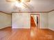 Large living room with hardwood floors and access to the staircase at 1200 Berkshire Dr, Kannapolis, NC 28081