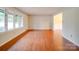 Bright living room featuring hardwood floors and large windows offering natural light at 1200 Berkshire Dr, Kannapolis, NC 28081