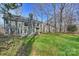 A serene backyard with lush greenery and mature trees for added privacy at 12724 Cliffcreek Dr, Huntersville, NC 28078