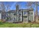 Exterior view of a beautiful home with a spacious deck and a well-maintained yard at 12724 Cliffcreek Dr, Huntersville, NC 28078