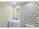 Modern bathroom with geometric tile wall and new vanity at 12724 Cliffcreek Dr, Huntersville, NC 28078