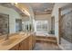 Bathroom with double vanity and garden tub at 12724 Cliffcreek Dr, Huntersville, NC 28078