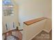 Bright open foyer with hardwood floors and staircase with carpeted steps at 12724 Cliffcreek Dr, Huntersville, NC 28078