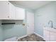 Bright laundry room with sink, cabinetry, and utility connections at 12724 Cliffcreek Dr, Huntersville, NC 28078