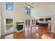 Bright living room boasts hardwood floors, fireplace, high ceilings and natural light at 12724 Cliffcreek Dr, Huntersville, NC 28078