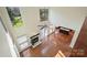 Aerial shot of living room with fireplace, fan, skylights, and hardwood floors at 12724 Cliffcreek Dr, Huntersville, NC 28078