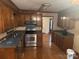 Traditional-style kitchen featuring wood cabinets, stainless steel appliances, and hardwood floors at 1313 Hickory Woods Dr, Monroe, NC 28110