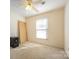 Bright bedroom with ample sunlight, showcasing neutral tones and a ceiling fan at 132 Stoneybrook Rd, Salisbury, NC 28147