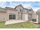 Exterior view of backyard with patio and sliding door at 1765 Holliford Ct, Charlotte, NC 28215