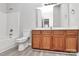 Bathroom featuring a tub, vanity, and white fixtures at 1765 Holliford Ct, Charlotte, NC 28215