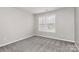 Bedroom with neutral carpet, light gray walls and natural light at 1765 Holliford Ct, Charlotte, NC 28215