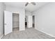 Cozy bedroom features a ceiling fan, walk-in closet, and ensuite bathroom at 1765 Holliford Ct, Charlotte, NC 28215
