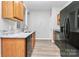 Functional kitchen with stainless steel appliances, light wood cabinetry, and stylish countertop at 1765 Holliford Ct, Charlotte, NC 28215