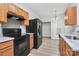 Well-lit kitchen featuring modern appliances, updated countertops, and ample storage space at 1765 Holliford Ct, Charlotte, NC 28215